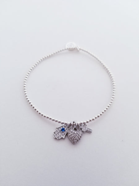 Stretch Bracelet with Heart, Hamsa, and Cross